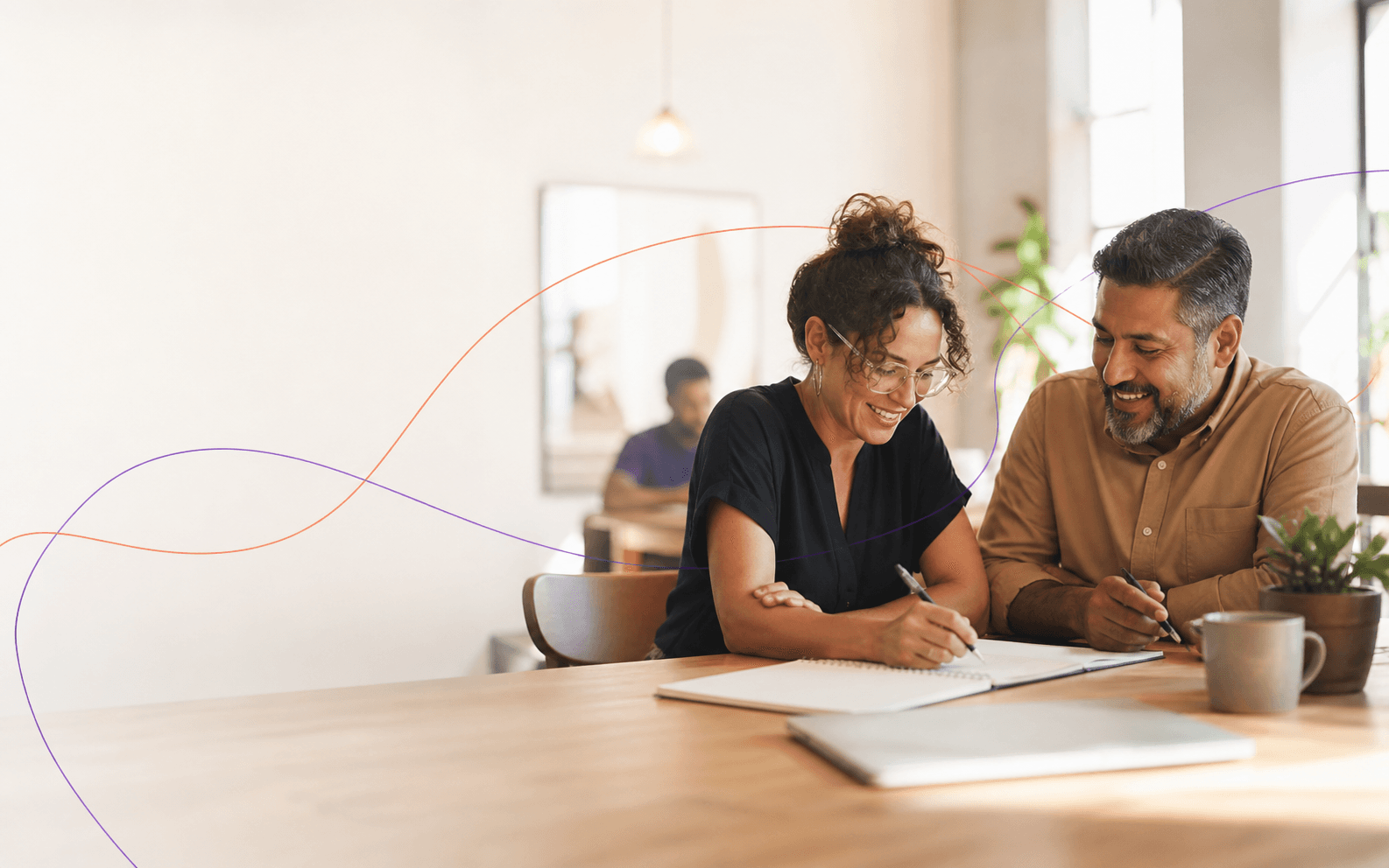 A small-business owner and community partner planning together